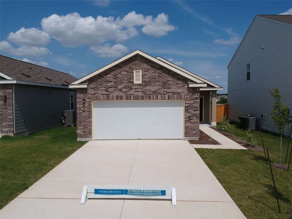 211 Enforcer Loop Jarrell, TX 76537 - Photo 1 of 1 a view of a backyard of a house