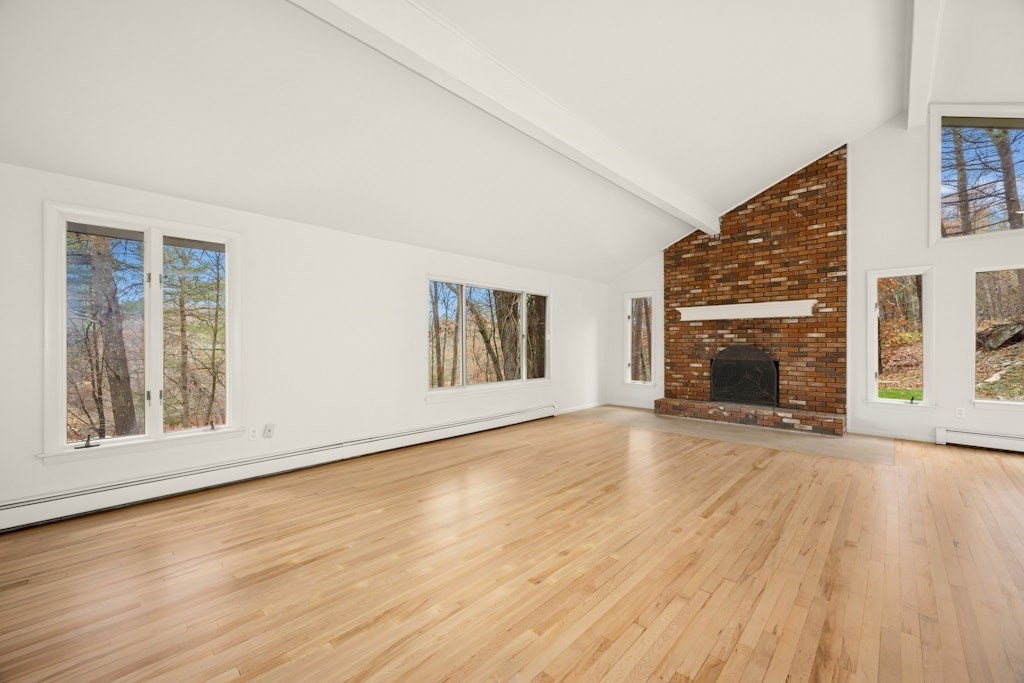 245 Brewer Street Northborough, MA 01532 - Photo 15 of 38 an empty room with wooden floor and fireplace