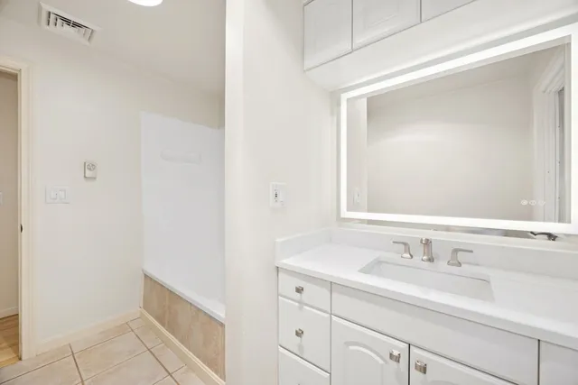 a bathroom with a bathtub toilet and sink