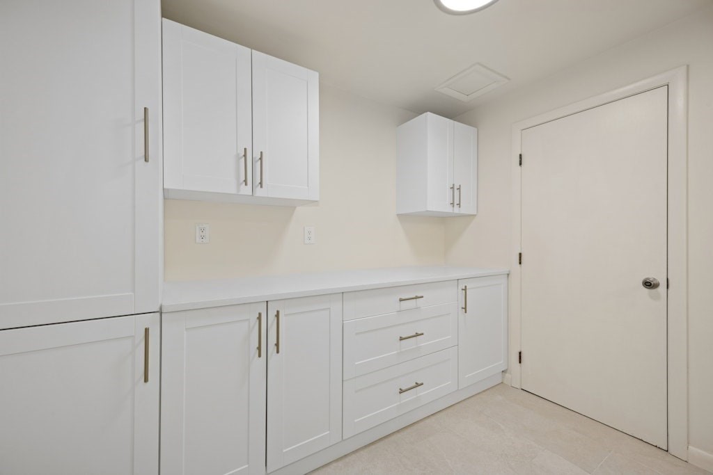 245 Brewer Street Northborough, MA 01532 - Photo 27 of 38 a kitchen with white cabinets and sink