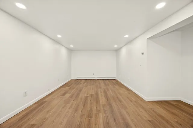 a balcony with wooden floor and fence