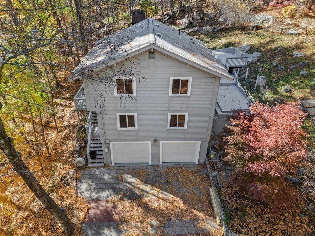 245 Brewer Street Northborough, MA 01532 - Photo 38 of 38 a view of a house with a yard and garage