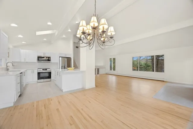 a view of a kitchen with a sink dishwasher and microwave