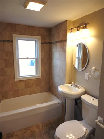 21 Anne Street Springfield, MA 01104 - Photo 24 of 27 a bathroom with a sink toilet and shower