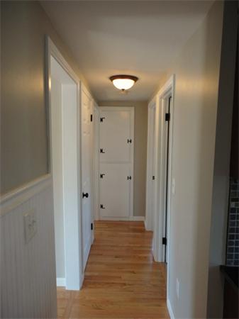 21 Anne Street Springfield, MA 01104 - Photo 25 of 27 a view of a hallway with wooden floor