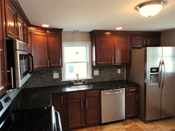 21 Anne Street Springfield, MA 01104 - Photo 27 of 27 a kitchen with stainless steel appliances a refrigerator sink and stove