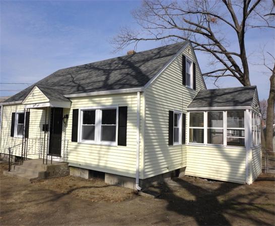 21 Anne Street Springfield, MA 01104 - Photo 3 of 27 a view of a house with a small yard and wooden floor and fence