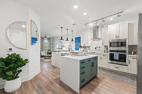 a kitchen with a sink and cabinets