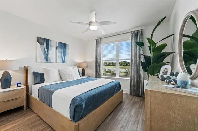 a bathroom with a granite countertop sink a toilet and a mirror