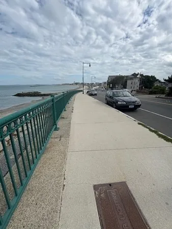 a view of building with car parked