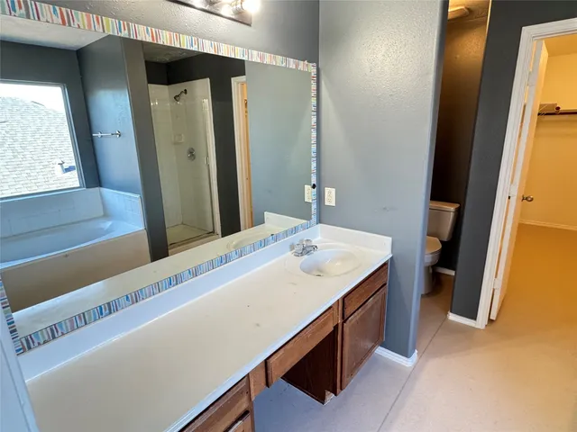 a room with a sink and a mirror