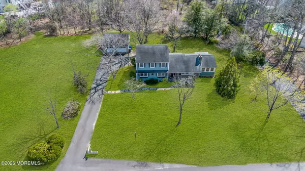 a view of a field of grass and trees