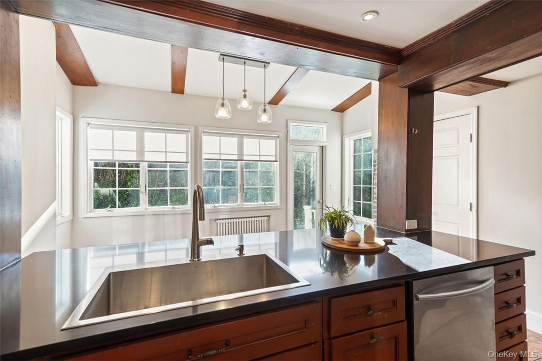 246 Mamaroneck Road Scarsdale, NY 10583 - Photo 15 of 35 Kitchen with beamed ceiling and pendant lighting