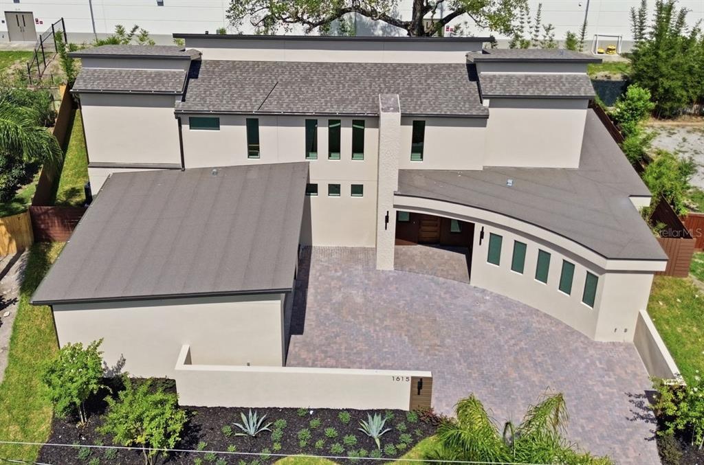 1615 Cole Road Orlando, FL 32803 - Photo 4 of 31 an aerial view of a house with a yard and garage