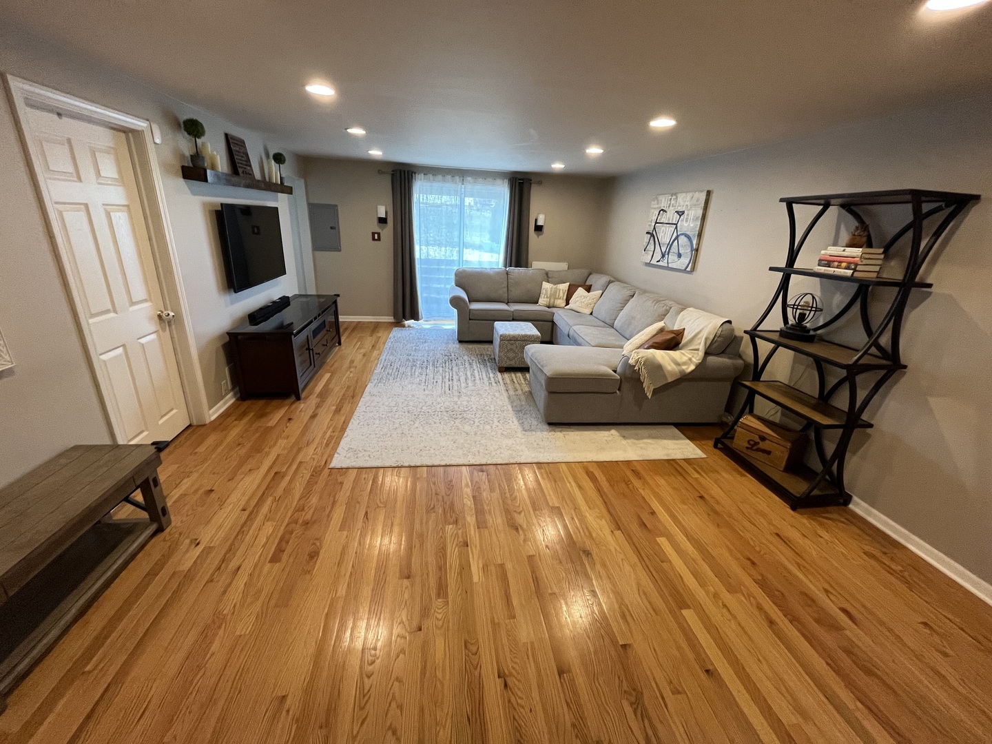 7621 Sawyer Road Darien, IL 60561 - Photo 14 of 28 a living room with furniture and a flat screen tv