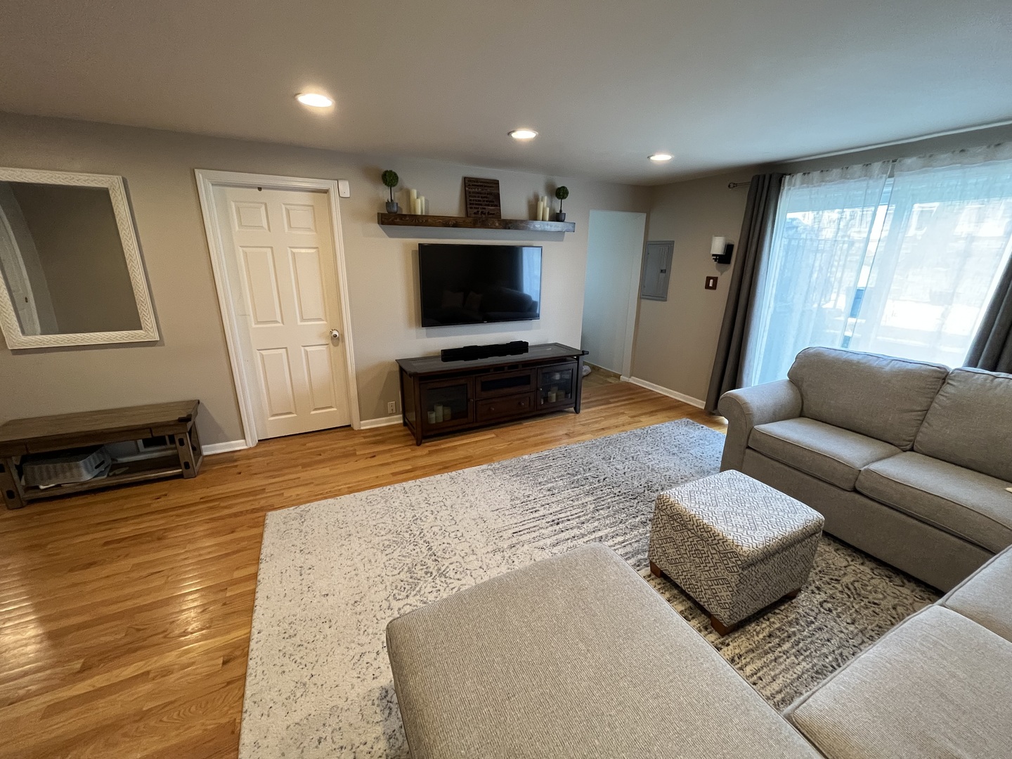 7621 Sawyer Road Darien, IL 60561 - Photo 15 of 28 a living room with furniture and a flat screen tv