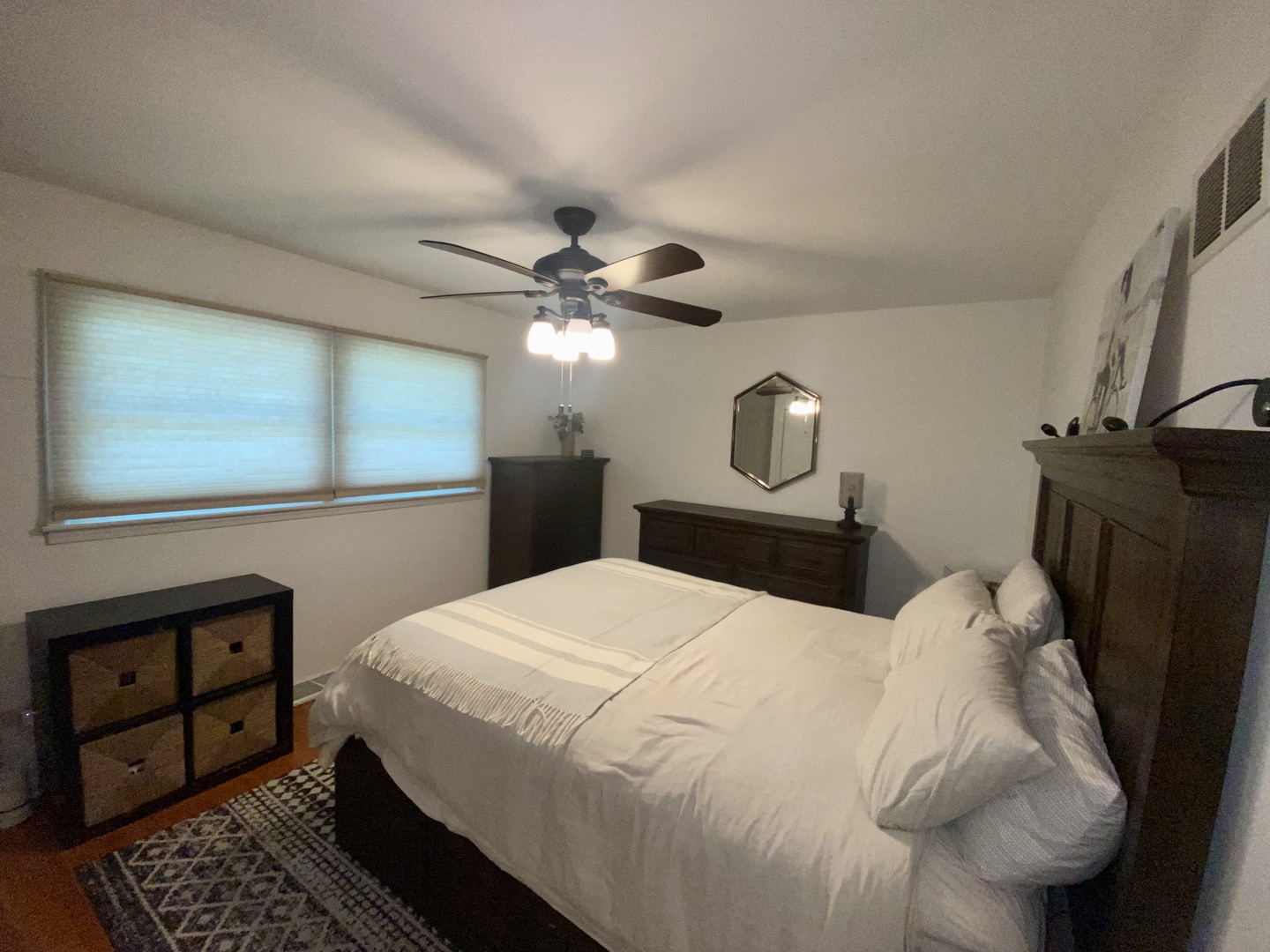 7621 Sawyer Road Darien, IL 60561 - Photo 19 of 28 a bedroom with a bed and a mirror on the dresser