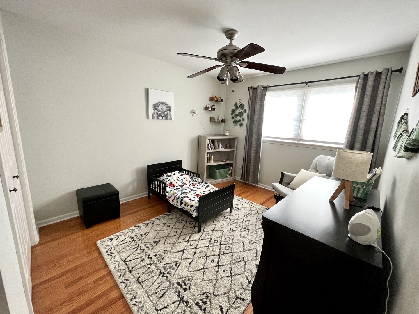 7621 Sawyer Road Darien, IL 60561 - Photo 20 of 28 a bedroom with furniture and a window