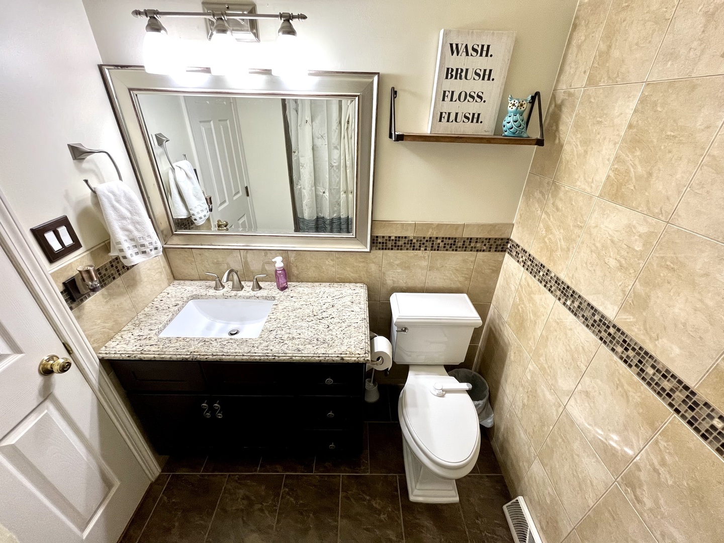 7621 Sawyer Road Darien, IL 60561 - Photo 23 of 28 a bathroom with a granite countertop sink and a mirror