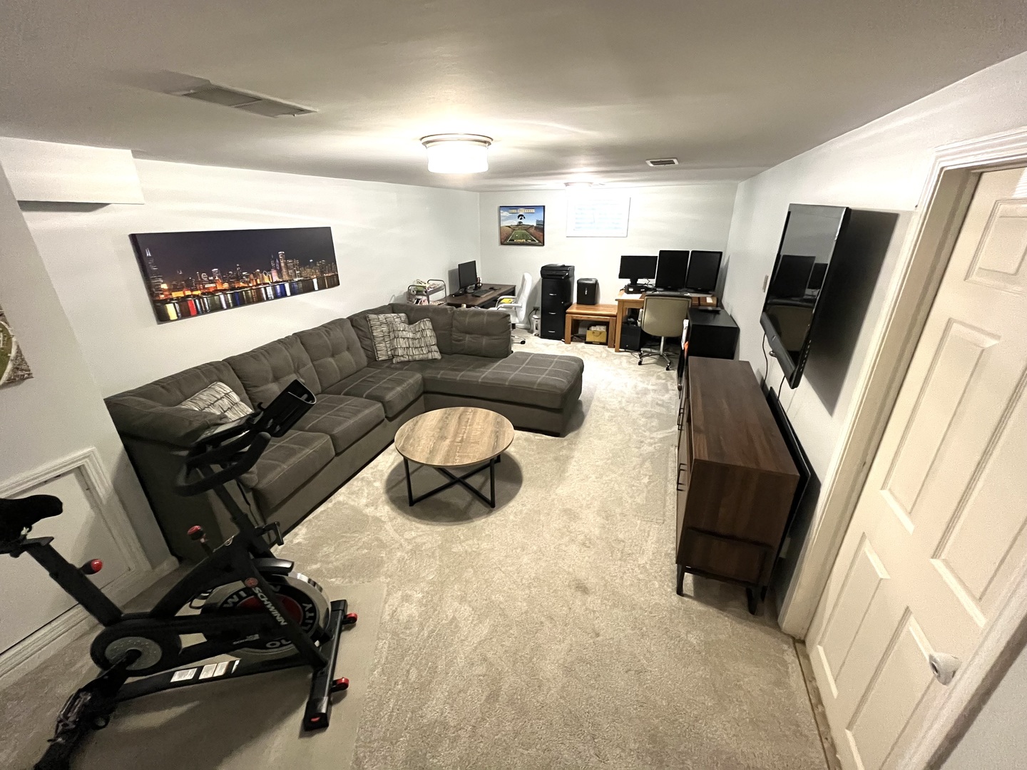 7621 Sawyer Road Darien, IL 60561 - Photo 27 of 28 a living room with furniture and a flat screen tv