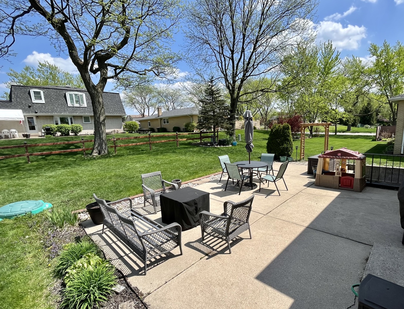 7621 Sawyer Road Darien, IL 60561 - Photo 6 of 28 a view of a patio with table and chairs and a big yard