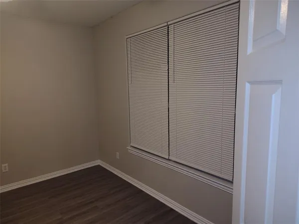 a view of a small space with wooden floor