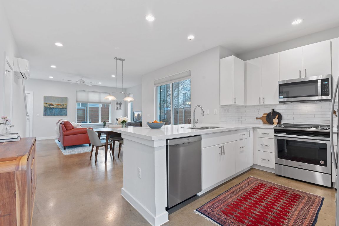 1902 Turtle Spring Court Austin, TX 78723 - Photo 1 of 1 a kitchen with a sink cabinets and window