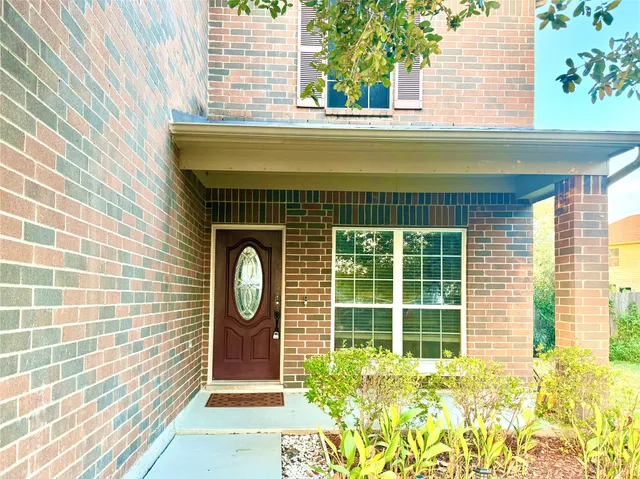 a front view of a house with a large window