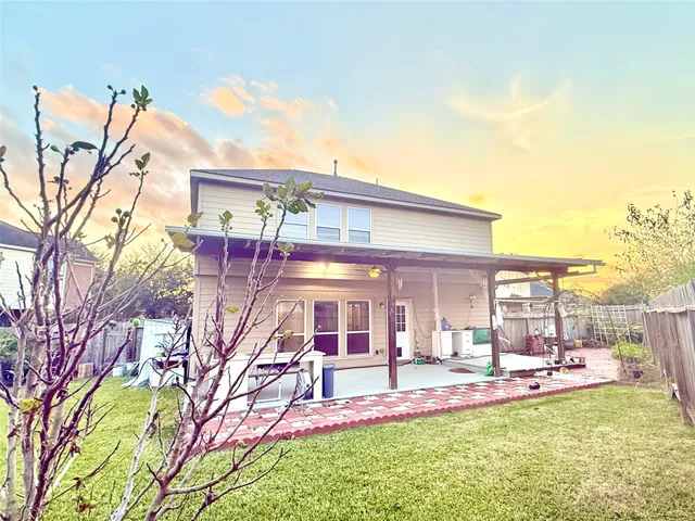 a view of a house with a big yard and chandelier