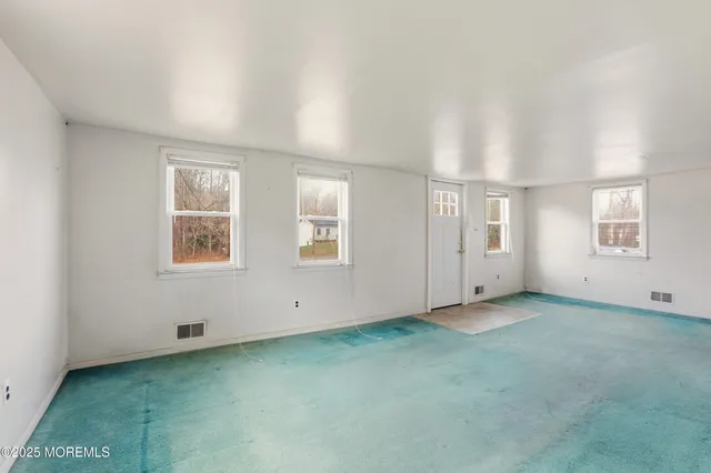 an empty room with windows