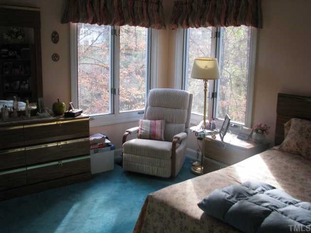 7301 Still Pond Court Raleigh, NC 27613 - Photo 11 of 12 One of the main level bedrooms, spacious, bright & sunny. Bedroom