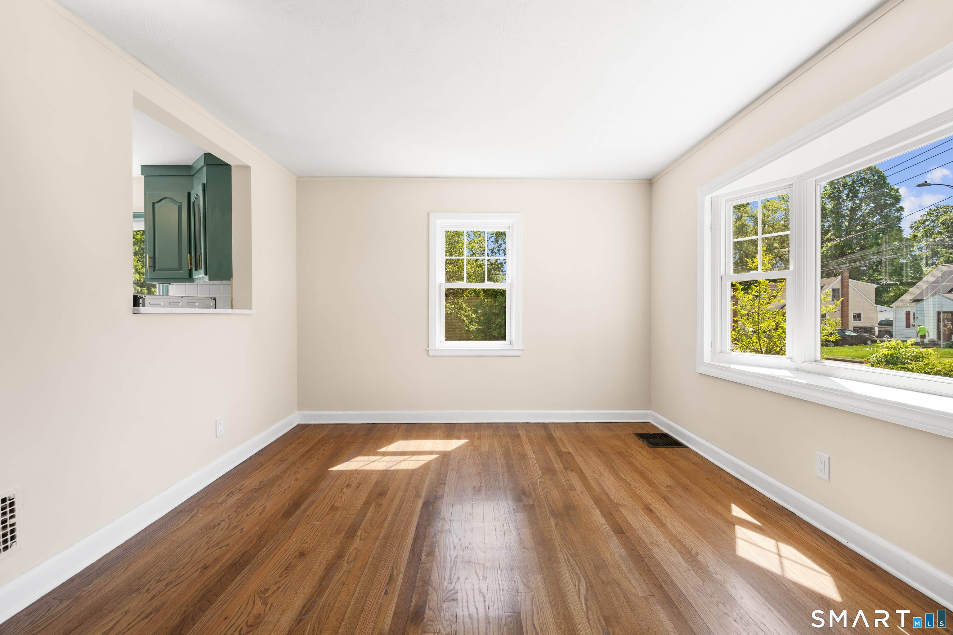175 Moody Street Bristol, CT 06010 - Photo 8 of 28 a view of a room with wooden floor and windows