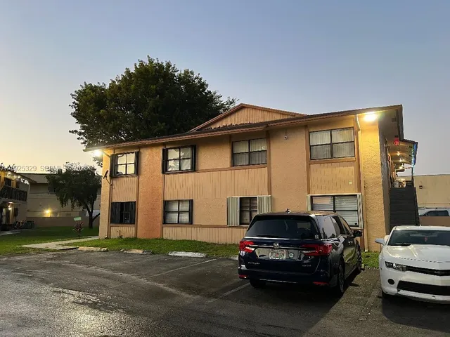 a car parked in front of a house