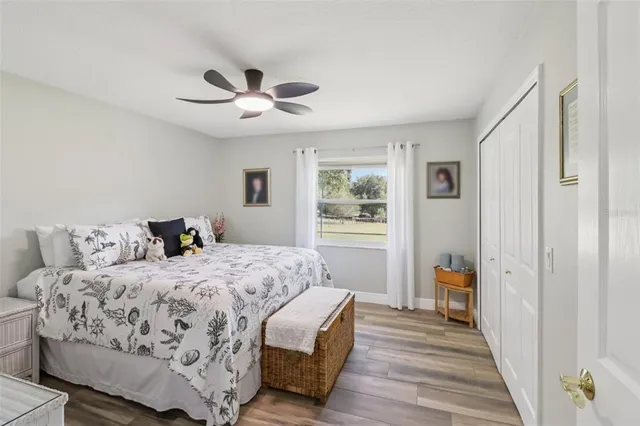a bedroom with a large bed and a window