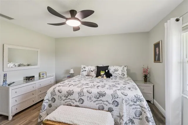 a bedroom with a bed and a dresser in it