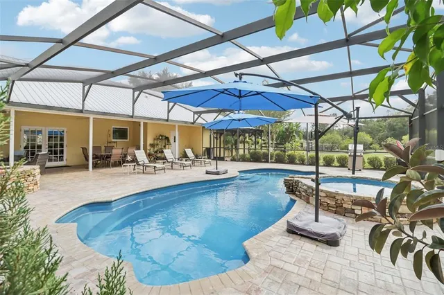 a view of a swimming pool with a patio