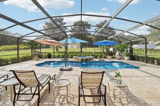 a view of a swimming pool with a patio