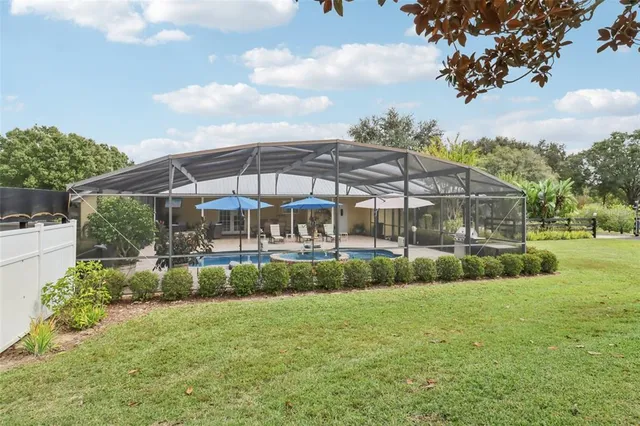 a view of a house with a yard