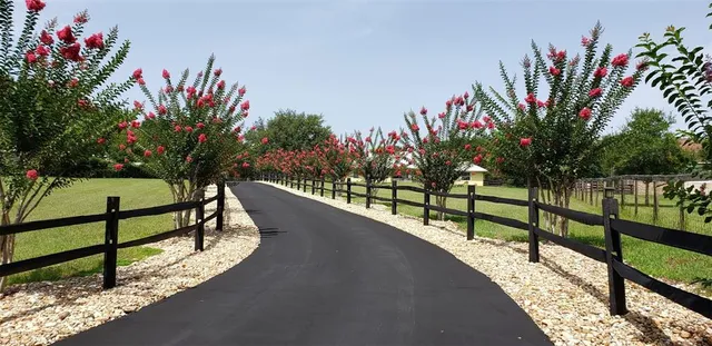 a view of a balcony with wooden fence