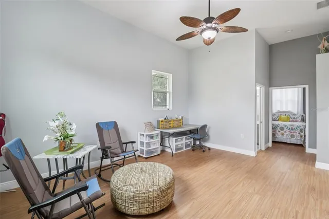 a dining room with furniture and window