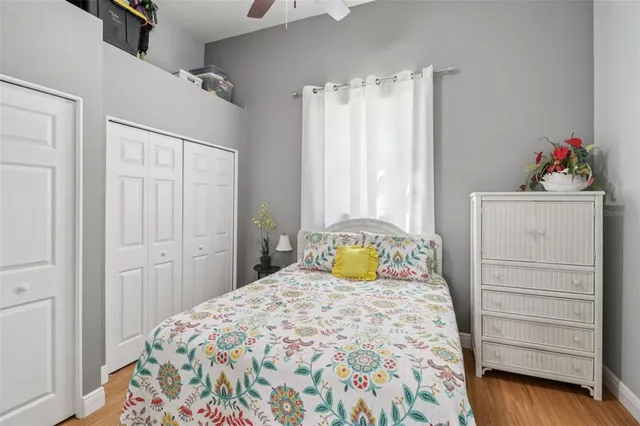 a bedroom with a bed and cabinets