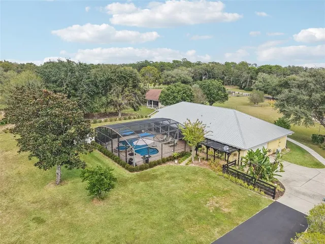 an aerial view of a house having yard