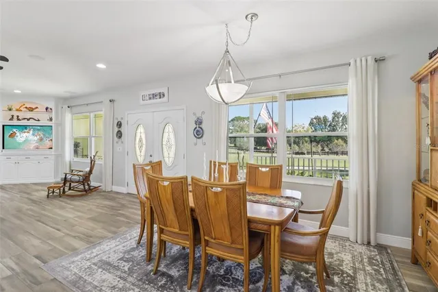 a dining room with furniture window wooden floor