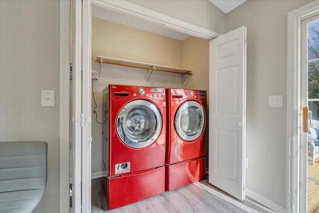 a view of a deck with wooden floor and barbeque oven