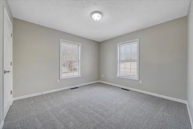 a view of balcony with wooden floor and fence