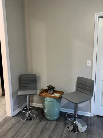 a room with furniture and a potted plant