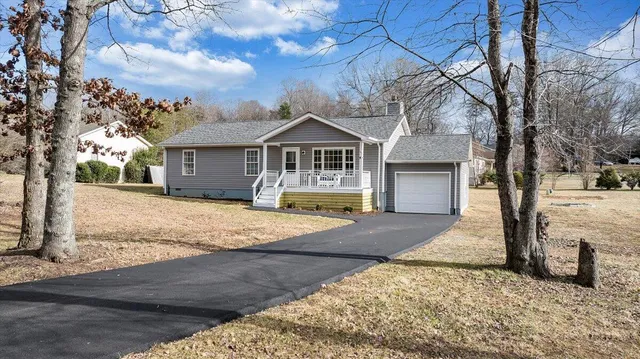 a balcony with wooden floor and furniture