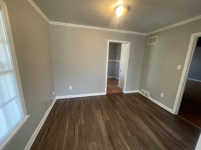 802 Waring Road Memphis, TN 38122 - Photo 4 of 12 a view of an empty room with wooden floor and a window