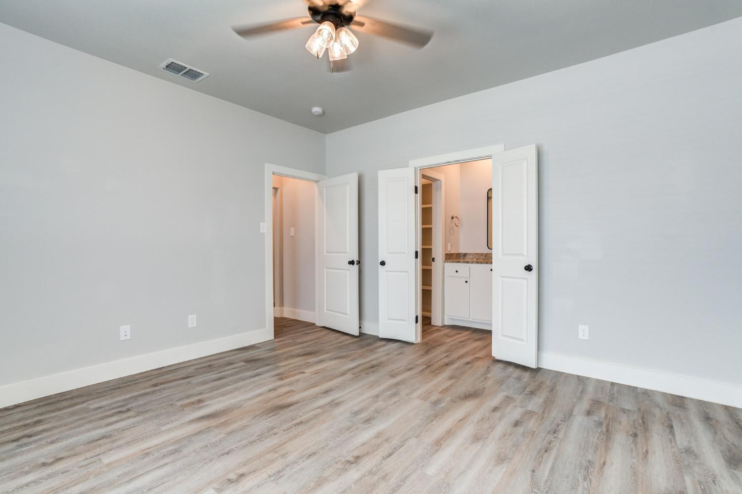2528 137th Street Lubbock, TX 79423 - Photo 18 of 35 a view of an empty room with wooden floor