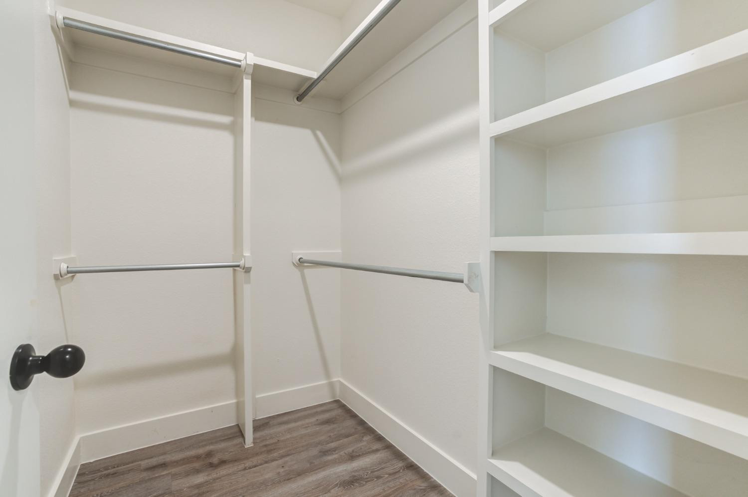 2528 137th Street Lubbock, TX 79423 - Photo 21 of 35 a view of walk in closet with empty racks